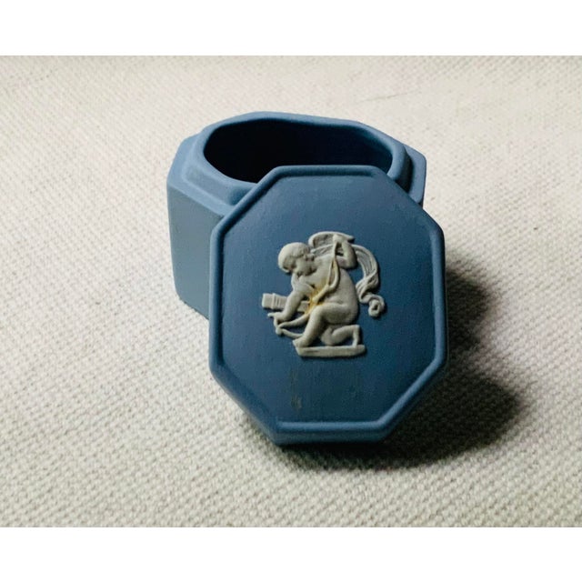 Step into the refined world of mid-century elegance with this exquisite three-piece Wedgwood jasperware desk set, where...