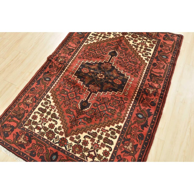This authentic vintage tribal Hamedan rug is hand-knotted with fine wool and natural dyes. This nomadic oriental rug...