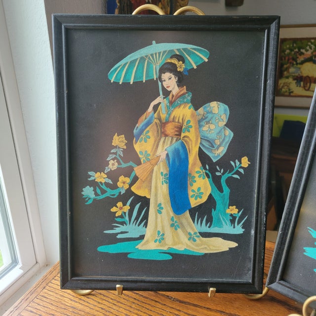 This product is a set of two vintage 1950's Geisha paintings on black felt, framed in matching frames. The paintings are...