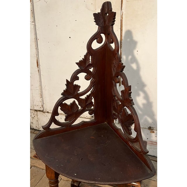 Victorian carved black walnut corner shelf. Good color and finish. Eastlake Style. Dimensions: W: 21.25" x D: 15" x H: 24"...