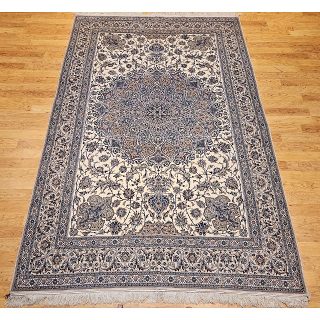 "This authentic vintage Persian Nain rug, hand-knotted in Nain in the late 20th century, showcases an extra fine weave and...