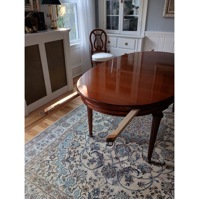 This is a French Louis XVI oval table in plain cherry wood in perfect condition. The legs can be removed and the...