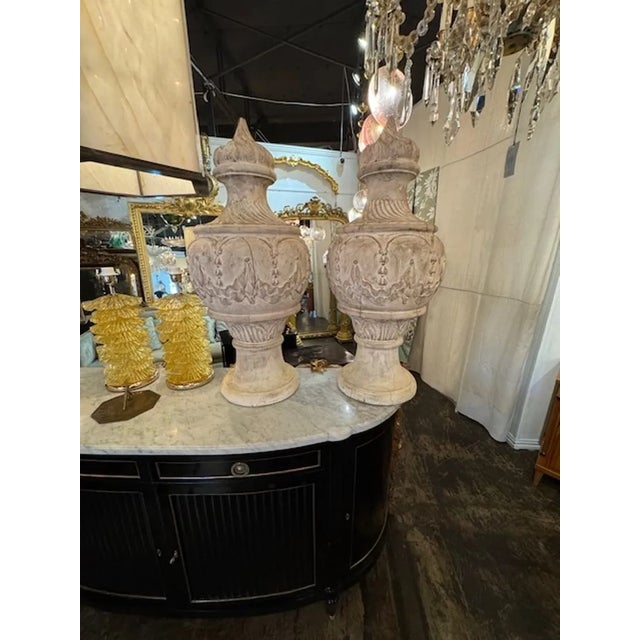 Beautiful large-scale pair of 19th century carved and white-washed wooden urns. Makes an impressive statement. Circa 1890....