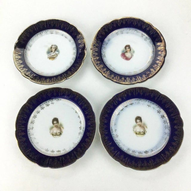 Set of 4 small plates hand painted with gold leaf over cobalt and white porcelain. No chips and in perfect condition with...