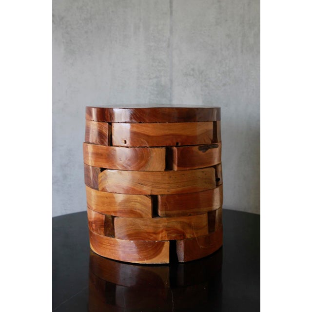 This versatile piece features stacked teak wood blocks that serve as a side table, bench, stool, or pedestal. Crafted for...