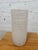 This is a mid-century modern ribbed cylinder vase from the Zanesville Stoneware Company (often referred to simply as...