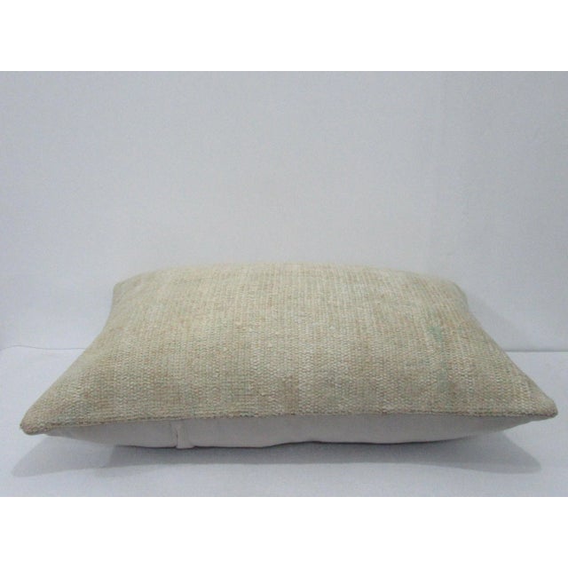Decorative pillow cover made from a vintage Turkish handknotted rug. Backed with good quality cotton fabric. Pillow...