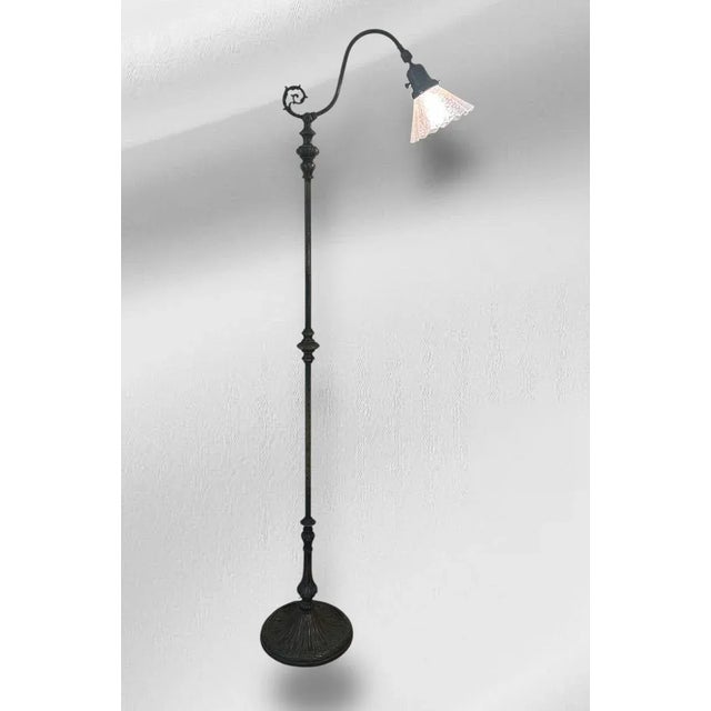 This tall floor lamp boasts a thin, simple, and graceful design. It has a lovely rustic patina from top to bottom! There...