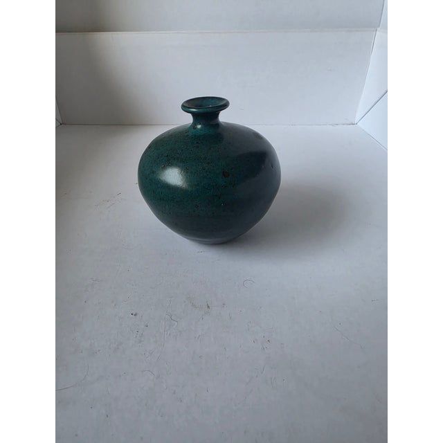 Signed studio pottery vase. Teal to dark green glaze. Glaze is imperfect as designed. Vintage.