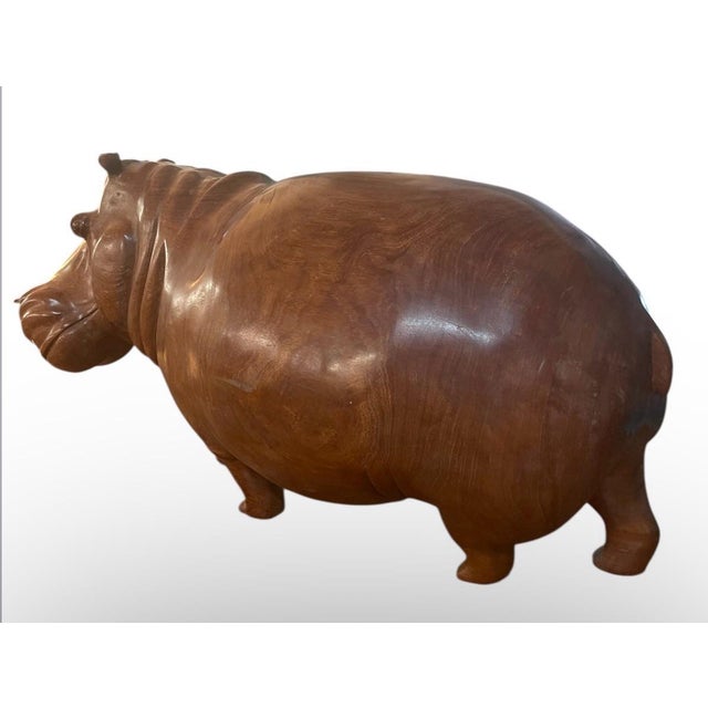 Make a bold statement with this large hand-carved wooden hippopotamus. Measuring 43 inches long, it’s a substantial piece...