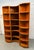 A beautifully crafted vintage Danish modular shelving unit, featuring warm teak construction and distinctive curved...