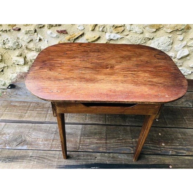 Mid-century, vintage, side table/nightstand, circa 40's -50's. Table is made of pine wood and has a rectangular top with...