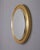 Round wall mirror with gilded brass frame and cut glass, Italian design, 1970s.