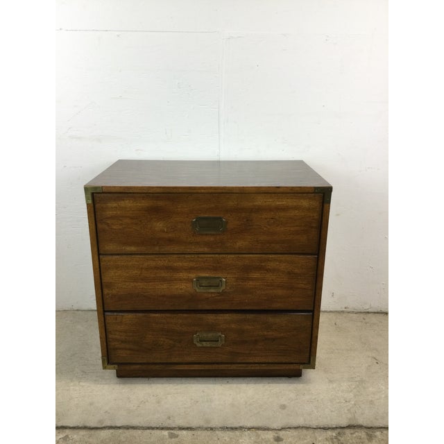 This mid century campaign style dresser features dark oak finish, durable vinyl top with faux wood grain, three dovetailed...