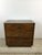 This mid century campaign style dresser features dark oak finish, durable vinyl top with faux wood grain, three dovetailed...