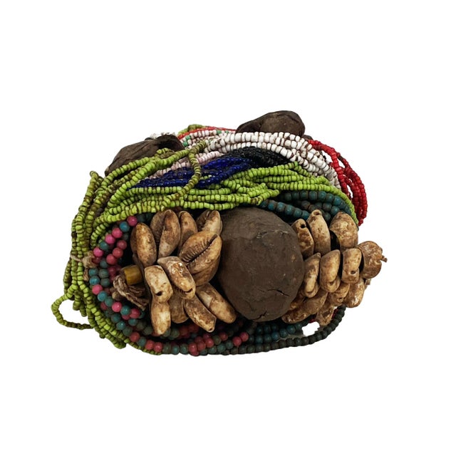 Superb African fertility doll decorated with multiple layers of beads and cowrie shells, as well as leather amulets 9" h...