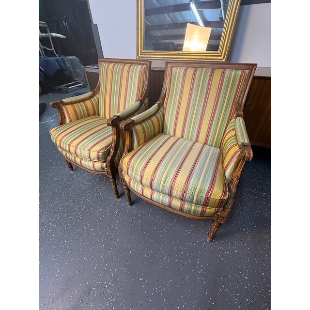 Beautiful pair of Hancock & Moore upholstered, French style armchairs.