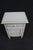 Charming Louis XVI-style nightstand featuring a single drawer over a paneled cabinet door, raised molded top, fluted...