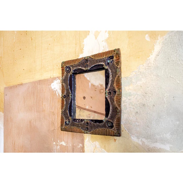 Mirror with ceramic frame. Made in Italy 1950s