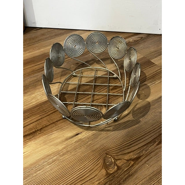 Vintage mid-century modern silver-tone coil wire basket. Can be used as a fruit bowl, planter or basket.