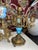 A stunning 5 piece mantle clock set complete with garnitures and candelabras. Finial on top of clock needs repair. I don’t...