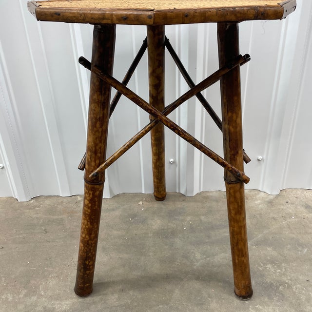 Late 19th century French Tortoise or Burnt Bamboo Octagonal table. Perfect piece for any room. Has original woven rattan top.