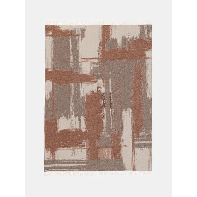 Jacquard wool and cashmere blanket with brushstroke motif from the Villa Como Collection.