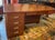 This 1930s Art Deco executive desk features a polished wood finish and distinctive chrome drawer pulls - It blends...