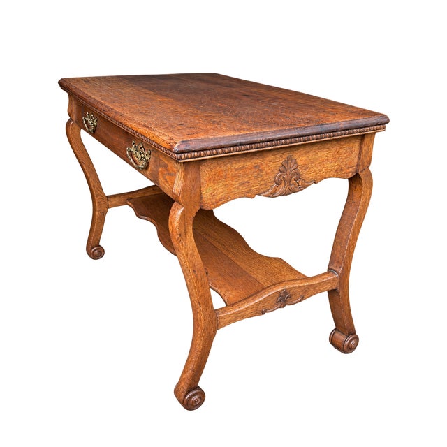 Beautiful Victorian tiger oak antique table. One long drawer with original pulls, dovetail joinery and lovely carved lower...