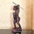 A commanding vintage hand-carved hardwood sculpture depicting an Igorot warrior from the northern Philippines. This...