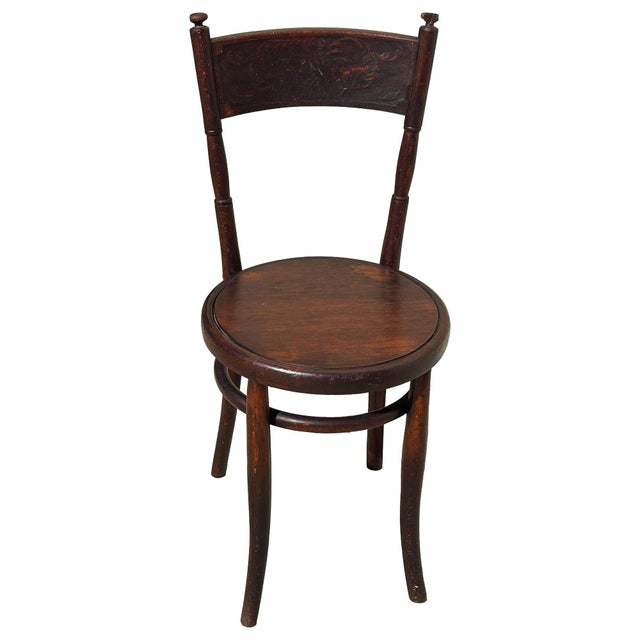 Victorian sculpted oak side chair with a carved Backrest by Jacob & Josef Kohnfeaturing an elegant, sculptural frame...