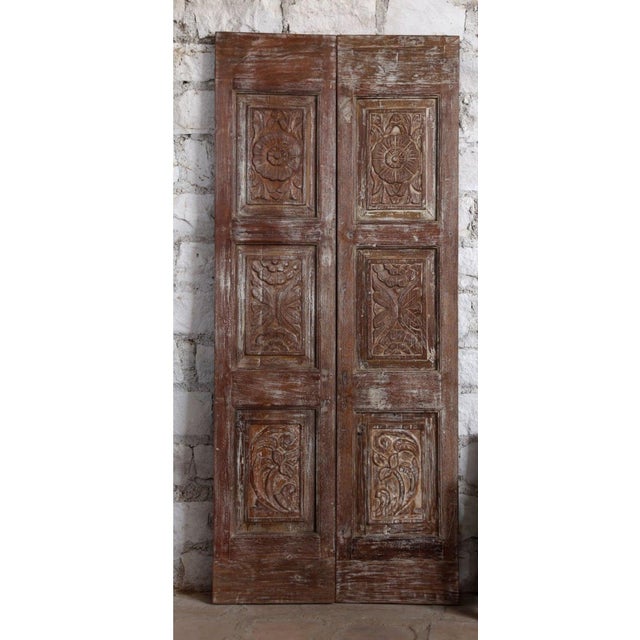 Bring timeless charm into your home with this exquisite pair of antique floral carved double doors. Crafted by skilled...