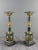 An elegant pair of decorative columns in veined green marble, richly adorned with gilt bronze and brass elements. the...