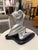 This mid-century modern plaster sculpture, finished in silver, depicts two abstracted figures in an intimate embrace. The...