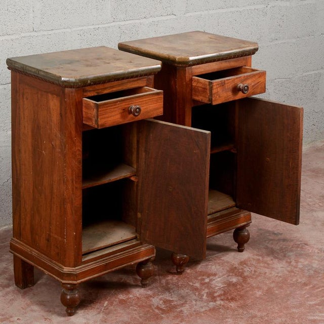A pair of antique nightstands dating from the late 19th century in the Umbertine style, characterized by harmonious...