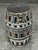 Design Plus Gallery presents a Fornasetti Casa con Colonne Stool. This is a hand-decorated cylindrical metal stool that...