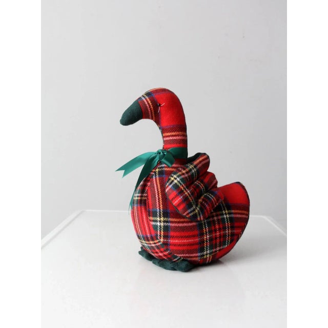 Adorn your holiday decor with this vintage handmade Christmas goose! Its festive plaid design and green ribbon around its...