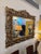 Impressive 19th-century wall mirror with an elaborately crafted, gilded decorative frame. The magnificent, openwork...