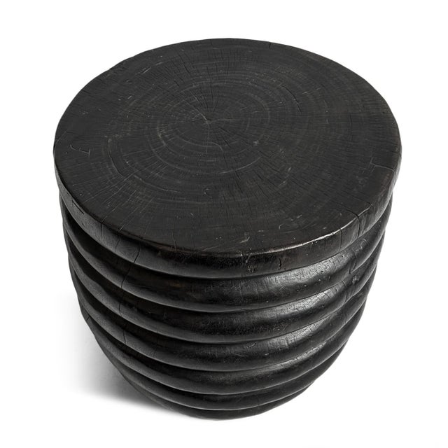 Beautiful vintage black ribbed solid hardwood stool or side table. Interesting modern hand carved layered ring shaped...