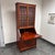 Design Plus Gallery presents a Circa 1970's Chinese Rosewood Secretary Desk Cabinet. The upper cabinet has glass paneled...