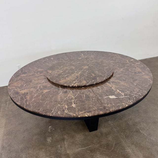 The Xilos dining table distinguishes itself through a geometric cross-shaped wooden framework that defines the...