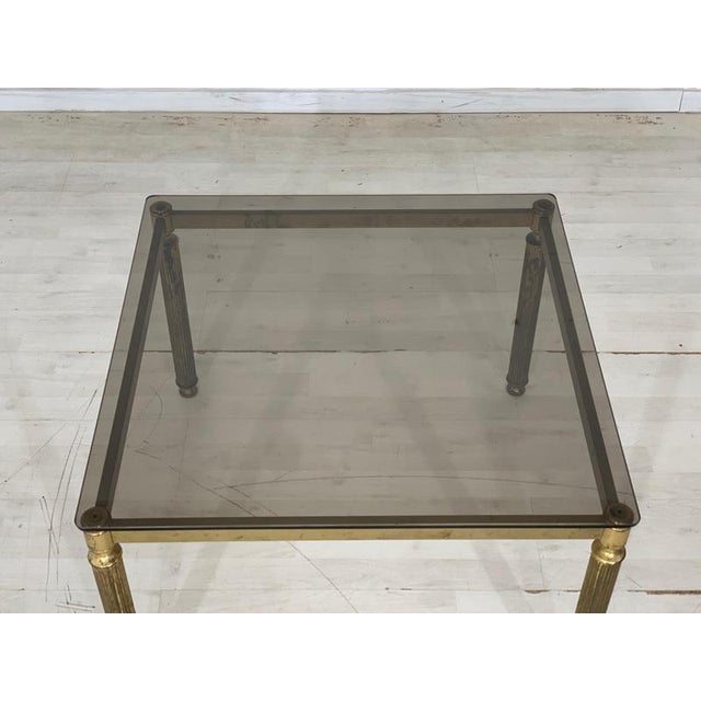 Beautiful glass table with brass frame. • German Design • 70s • Brass frame • good condition Dimensions: Height: 46 cm...