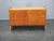 A refined mid-century sideboard produced in Czechoslovakia in the 1960s, featuring a warm maple veneer finish and a clean,...