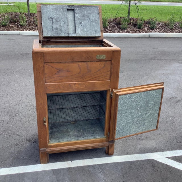 Antique White Clad top loading ice box. Solid oak construction, tin still holds water, circa 1880-1910.