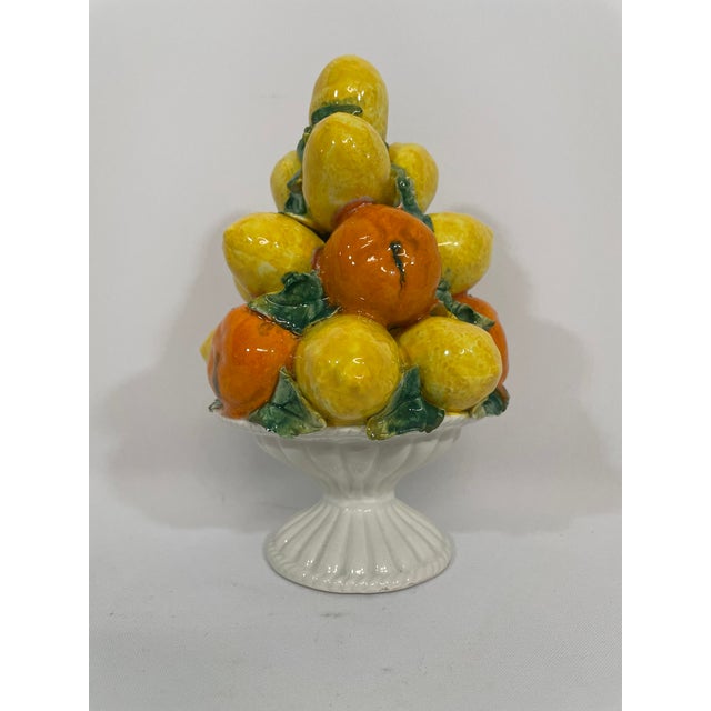 A bright yellow and orange petite 8" Italian ceramic Lemons and Oranges Topiary sitting in a stunning pedestal compote....