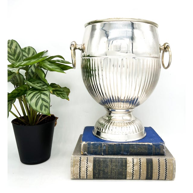 Elegant antique French champagne bucket or wine cooler in silver plate, dating to around 1900. Features a classic urn-form...