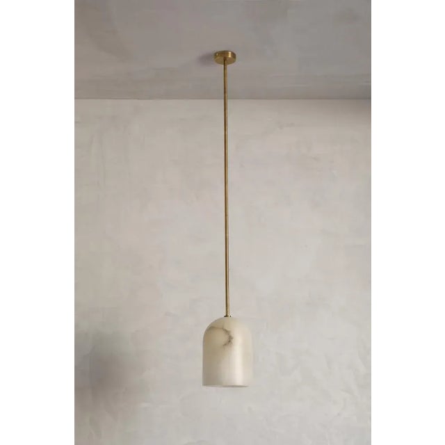 Belfry alabaster tube 22 pendant by contain dimensions: ø 22 x h 22 cm. Materials: brass structure and alabaster stone....