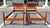 This vintage pair of mahogany twin bed frames features a warm, richly toned finish with classic turned posts and oval...