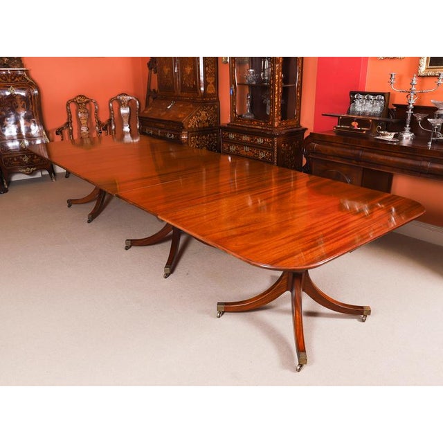 This is a fabulous Vintage Regency Revival dining table by master cabinetmaker William Tillman and a set of fourteen swag-...
