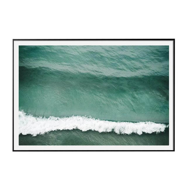 This photographic print by Southern California-based photographer Mo Gambill overlooks a dramatic cresting wave in the...